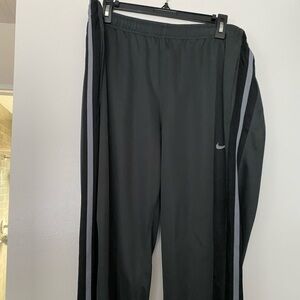 Men’s Nike track pants. In grey with black stripe. Size XL.